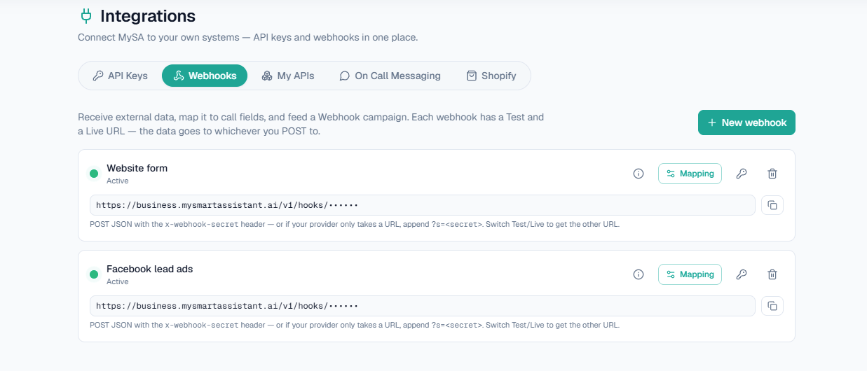 Integrations → Webhooks: each webhook with its status light, Test/Live URL and Mapping